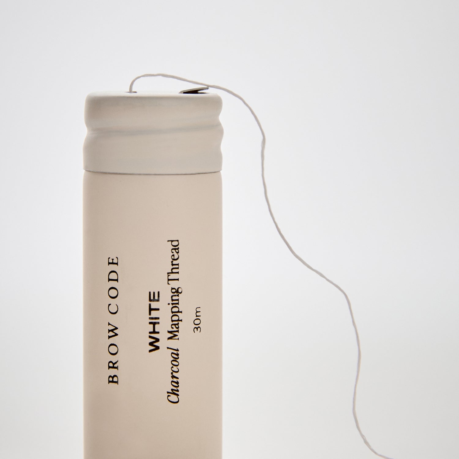 Charcoal_Brow_Mapping_Thread_Packaging standing up with thread coming out-color-white